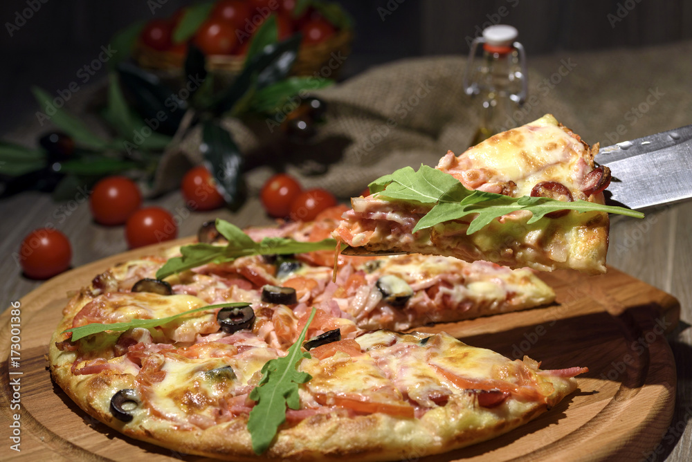Delicious fresh pizza served on wooden table Delicious fresh pizza served on wooden table