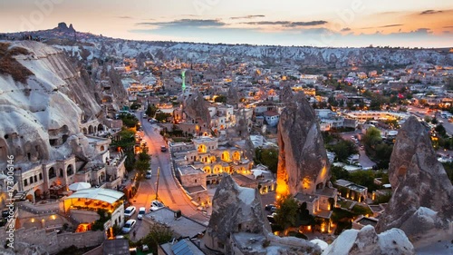 Timelapse view of Goreme village in Cappadocia at sunset in Turkey photo