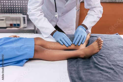 african american doctor examining patient
