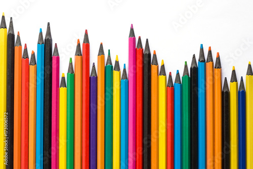 Set of multicolored pencils. color pencils arranged downward trend on white background, top view. Business concept