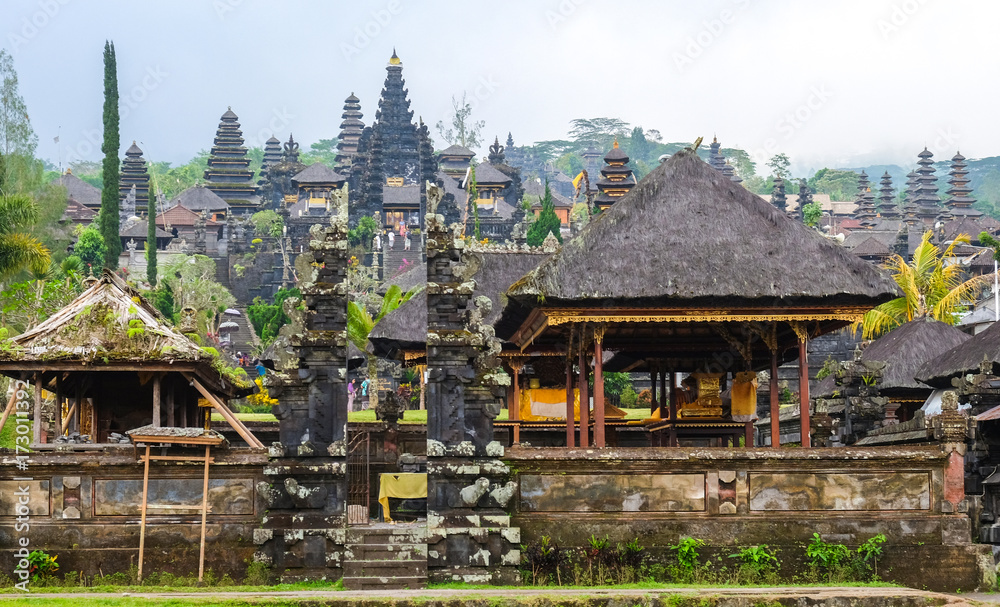 Besakih, Indonesia - September 9, 2017: Visitors explore the immense Pura Besakih Temple (Royal Temple of Besakih). the most important temple and holiest Hindu temple in Bali.
