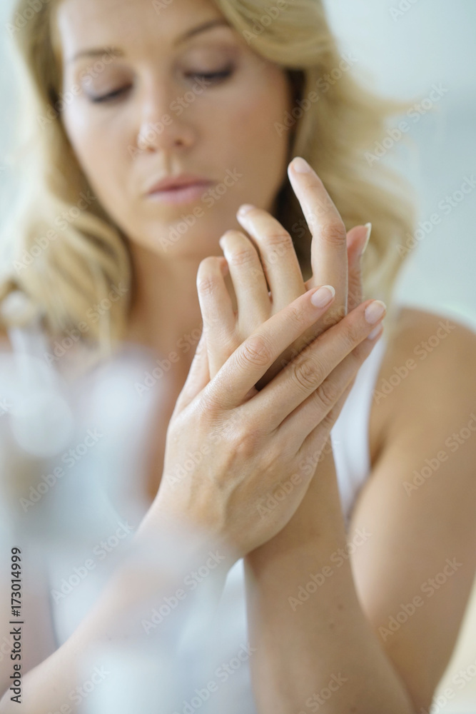 Closeup on woman's hands applying moisturizing hand-cream on Closeup on woman's hands applying moisturizing hand-cream on