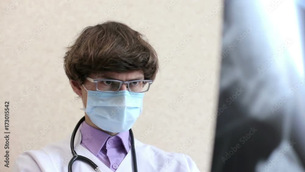 Doctor is looking an x-ray Doctor is looking an x-ray
