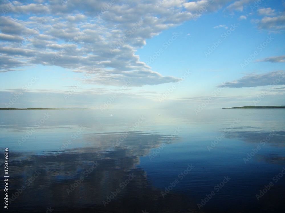 Onega lake with the reflection of the sky, Karelia, Russian North, Russia