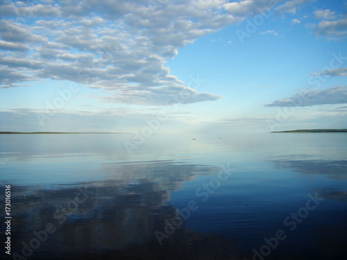 Onega lake with the reflection of the sky, Karelia, Russian North, Russia © Ольга Мещерякова