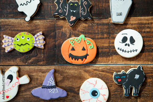 Funny Halloween cookies on a wooden background