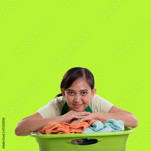 Laundry woman over green background