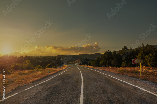 Nature landscape of sunset light above asphalt road © stdemiriz