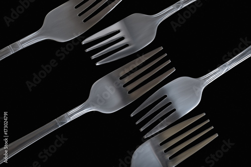 abstraction of forks on black background