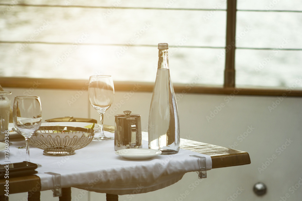 custom made wallpaper toronto digitaltable on the ship with a glass and a bottle of water