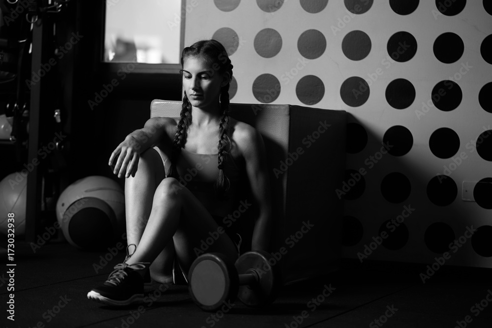 beautiful athletic woman working in gym