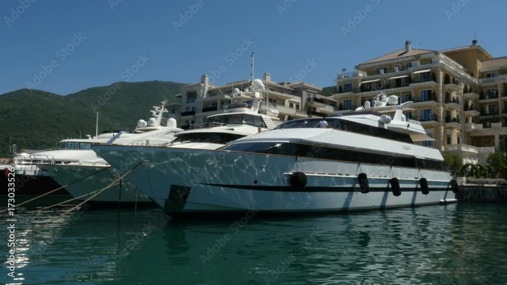 Luxury yachts moored on sea port Montenegro Luxury yachts moored on sea port Montenegro