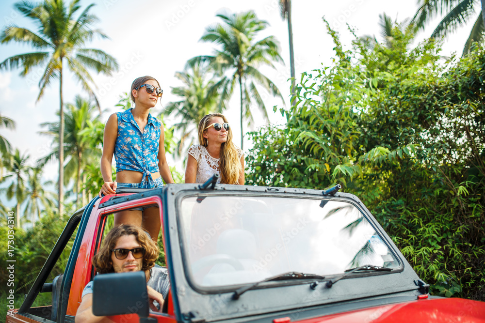 Naklejka premium group of three tourists in off road truck enjoying the nature on koh samui thailand
