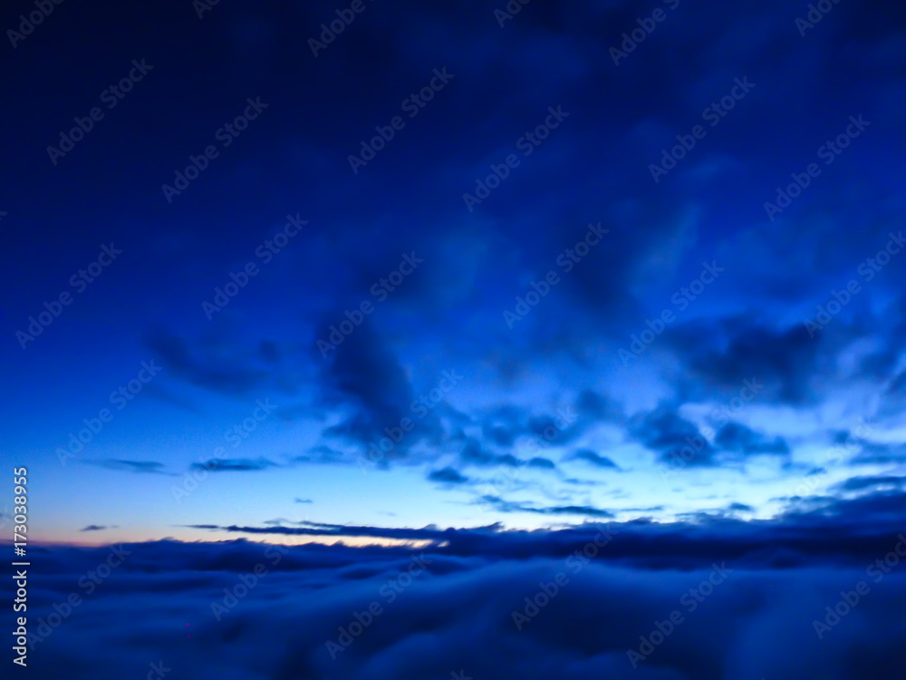 blur image - blue sky with cloud looking from the top of Fuji mountain in Japan at sunrise in the morning