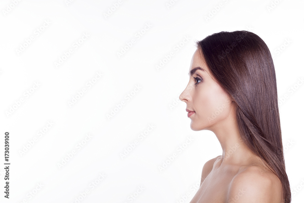 Side portrait of an attractive confident young woman. Side portrait of an attractive confident young woman.