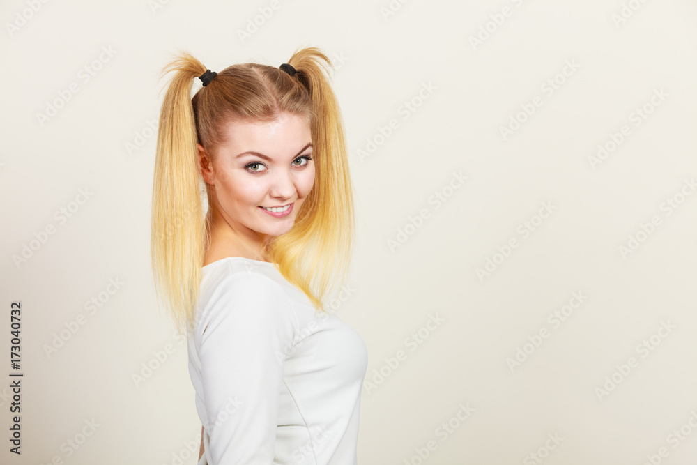 Happy blonde teenager girl with ponytails Happy blonde teenager girl with ponytails