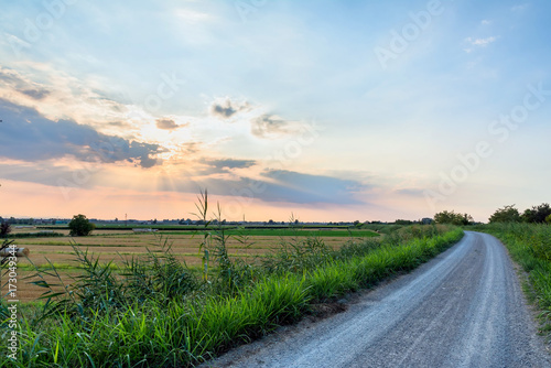 Pianura padana landscape at sunset with a dramatic sky photo