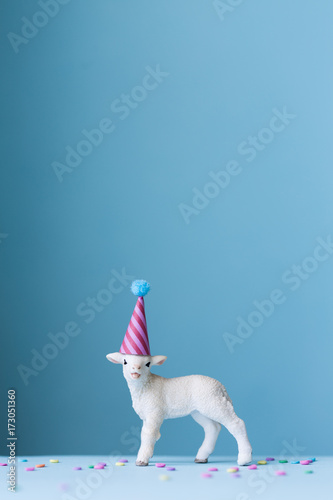 Toy lamb wearing a party hat