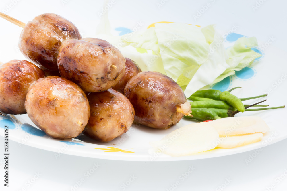Sai Aua (Notrhern Thai Spicy Sausage), Grilled sausages on a disk cuisine of northern Thailand, Thai street food. Sai Aua (Notrhern Thai Spicy Sausage), Grilled sausages on a disk cuisine of northern Thailand, Thai street food.