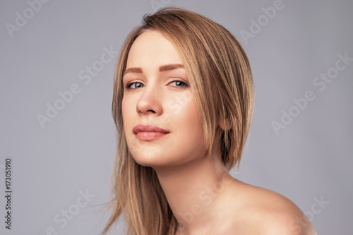 Portrait of young caucasian woman with perfect skin clean