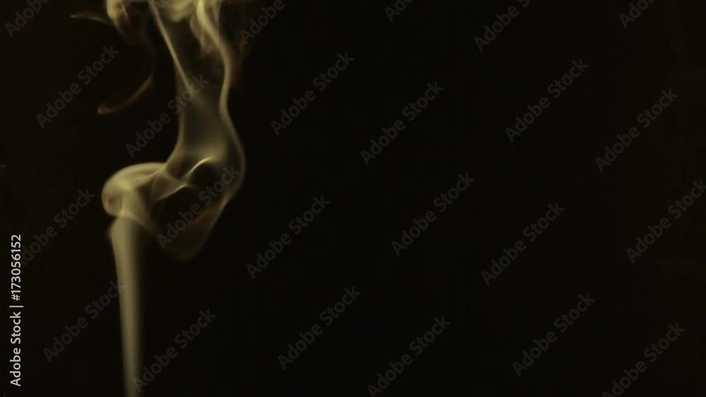 Beautiful stream of yellow smoke turns into swirls. Beautiful stream of yellow smoke turns into swirls.
