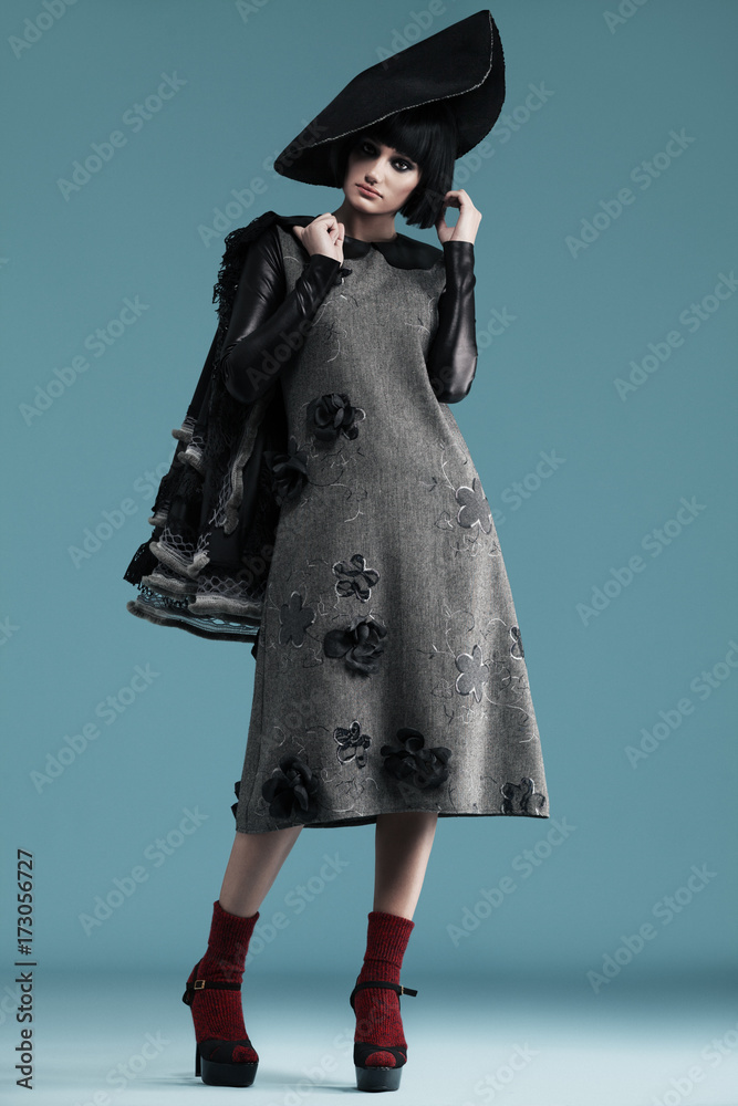 model wearing haute couture dresses on blue background model wearing haute couture dresses on blue background
