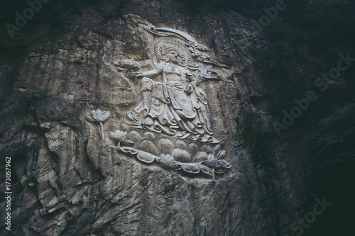 Arya Avalokiteshvara statue on the cliff photo