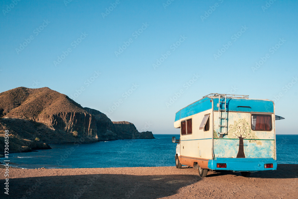 Hippie camper watching the sea Hippie camper watching the sea