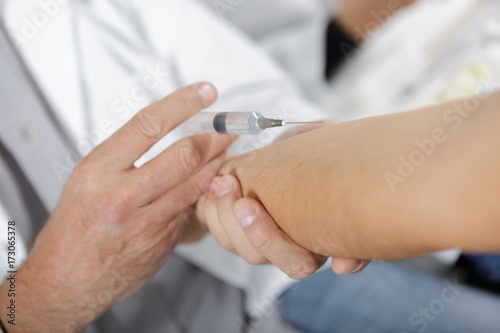 close up syringe to collect blood