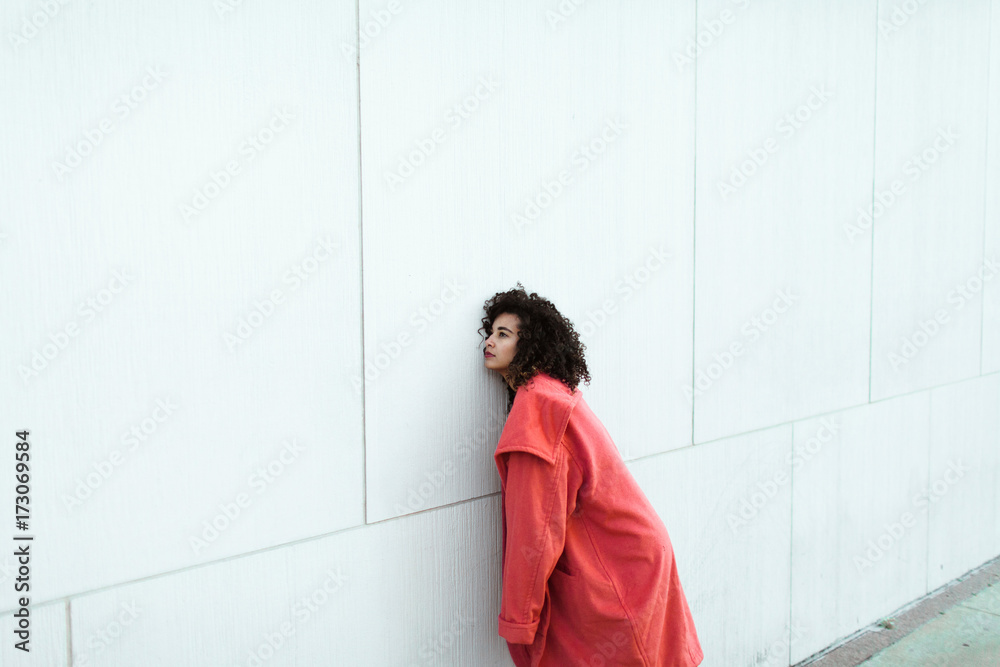 Young woman in a pink coat Young woman in a pink coat
