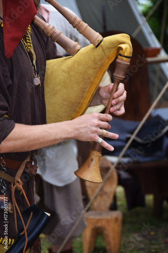 medieval musical instrument with inflatable sack  and a wooden flute