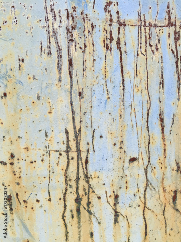 Detail of rusty metal trash can with scratch marks