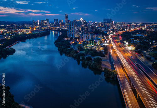 Downtown Austin, Texas during sunset featuring traffic on I-35 photo