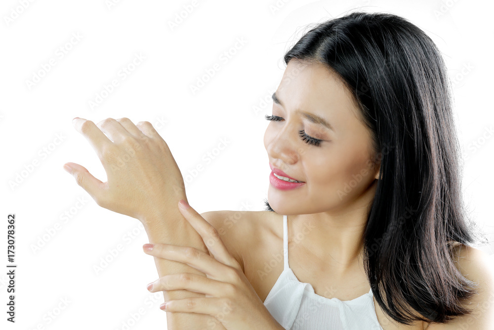 Pretty woman using skin care cream on studio Pretty woman using skin care cream on studio