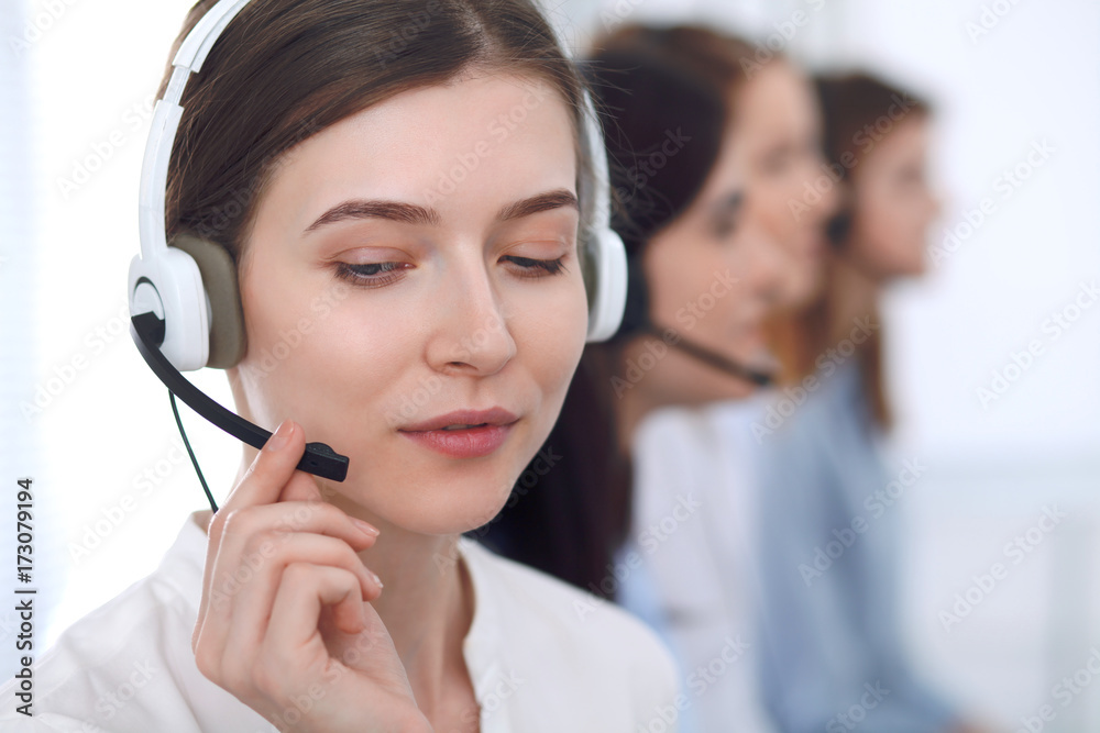 Call center operator.Young beautiful business woman in headset Call center operator.Young beautiful business woman in headset