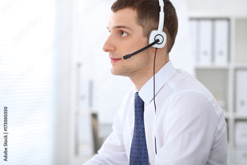 Young business man in headset. Call center Young business man in headset. Call center
