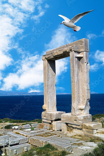 Ancient gate of Apollon temple at the island of Naxos in Greece photo