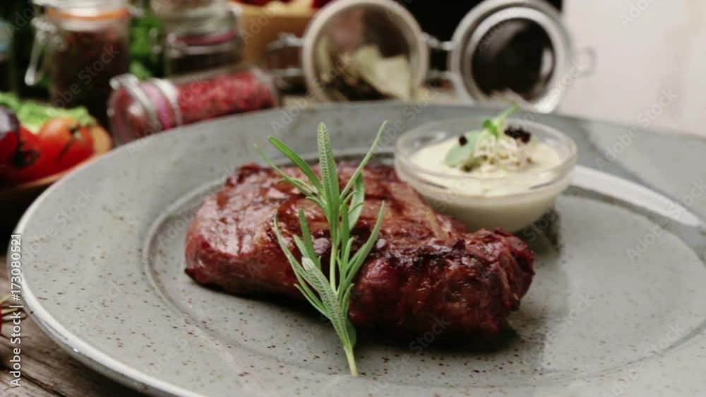 Composition with steak and spices on a plate. The beef steak is beautifully decorated in the restaurant. Correctly fried steak with sauces.
Composition with steak and spices on a plate. The beef steak is beautifully decorated in the restaurant. Correctly fried steak with sauces.