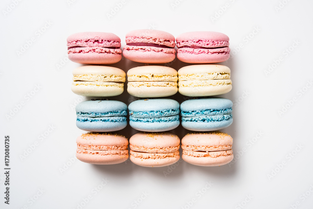 Fototapeta premium Colorful assorted macaroon cookies on white background