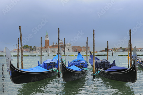 Traditional gondolas in the sea on background of ancient Venice, Italy © PROMA