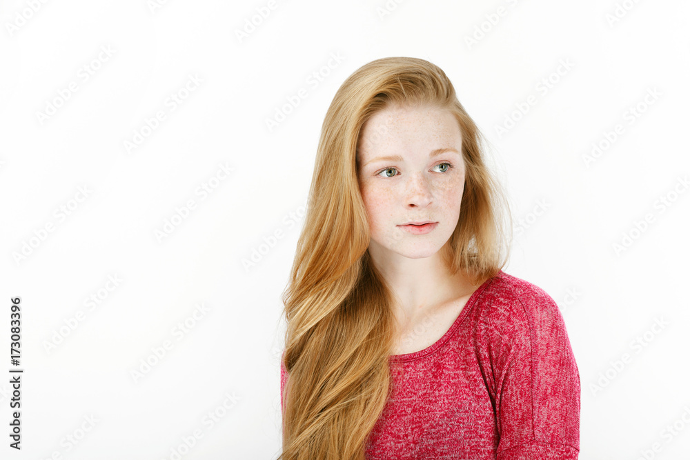 Beauty portrait of young adorable fresh looking redhead woman with gorgeous extra long hair. Emotion and facial expression concept. Beauty portrait of young adorable fresh looking redhead woman with gorgeous extra long hair. Emotion and facial expression concept.