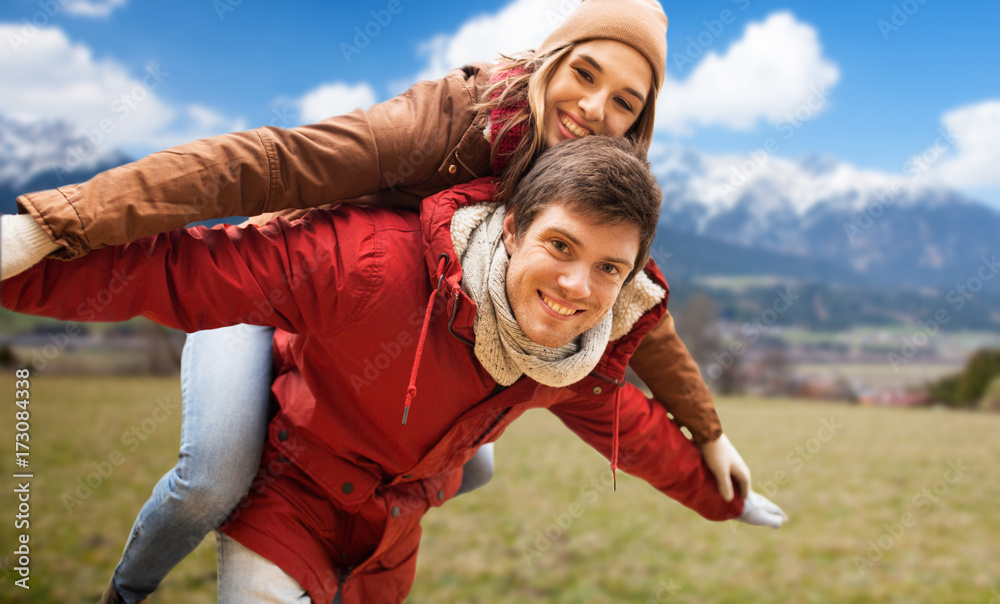 happy young couple having fun over alps mountains happy young couple having fun over alps mountains