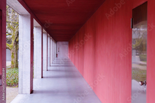 long corridor with red walls