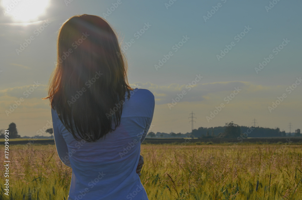young woman in the green field 