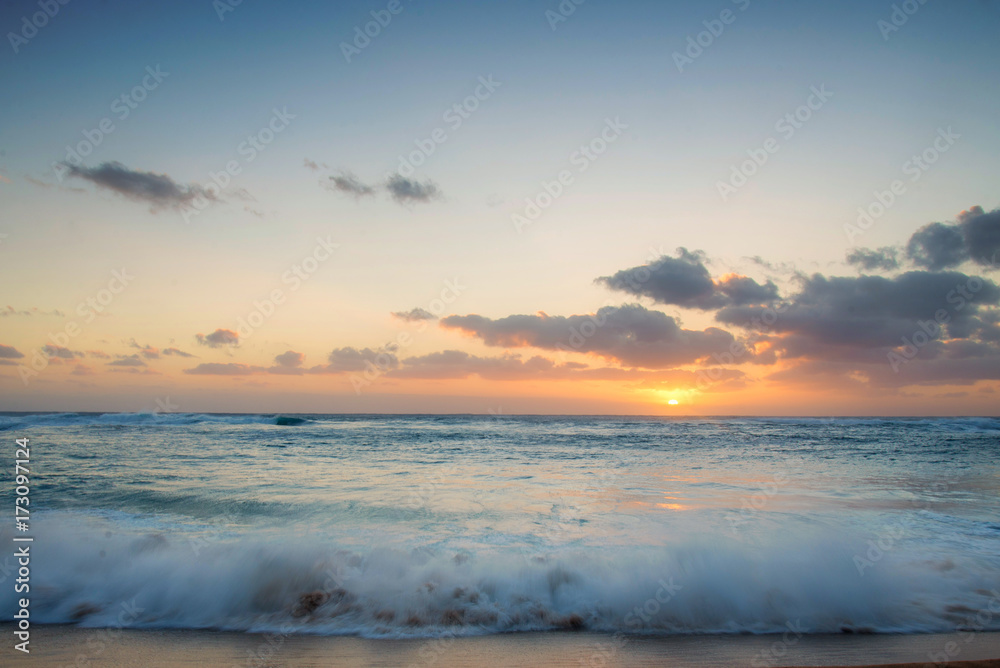 Golden hour sunset and a crashing wave