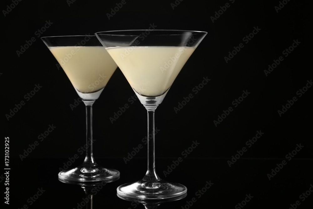 Glasses of lemon drop martini on black background Glasses of lemon drop martini on black background