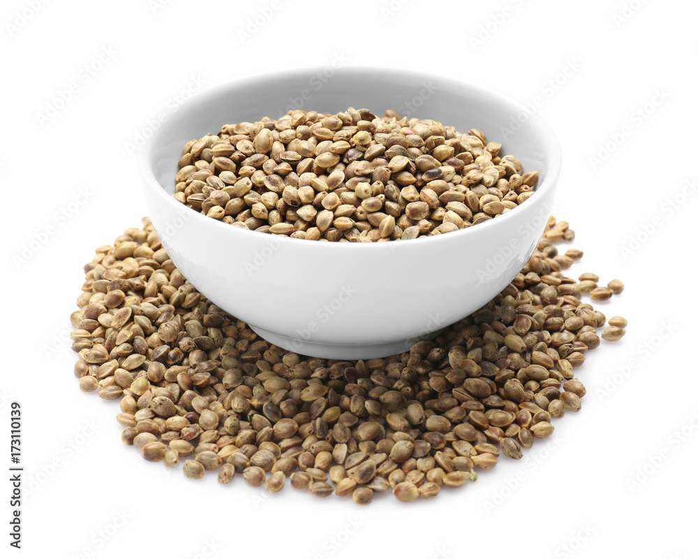 Bowl with hemp seeds on white background