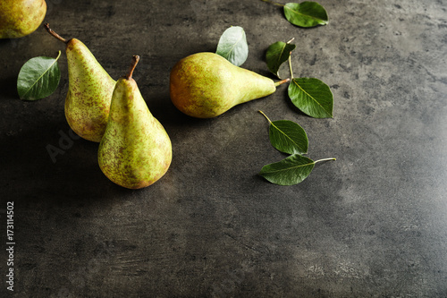 Ripe pears on dark background