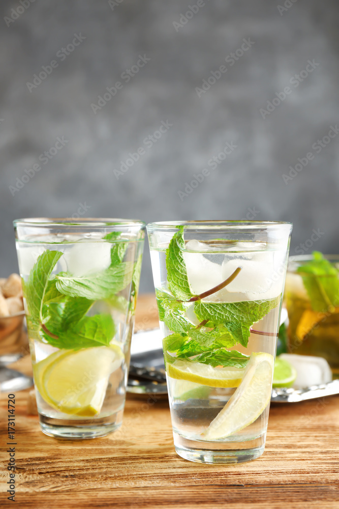 Two glasses with mint julep on wooden table Two glasses with mint julep on wooden table