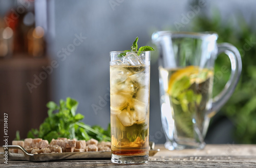 Long glass with mint julep on kitchen table